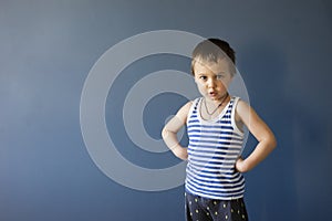 Happy child. ,Close-up portrait of a handsome boy with an angry expression