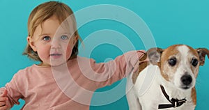 Happy child with dog. Portrait girl with pet