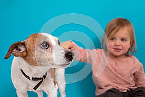 Happy child with dog. Portrait girl with pet