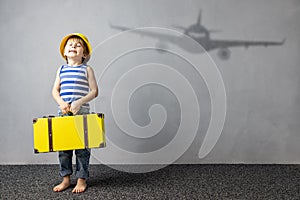 Happy child dreaming about travel