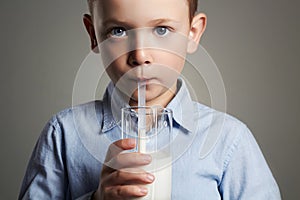 Happy Child drinking milk.Little Boy enjoy milk cocktail