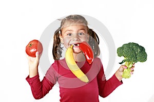 Happy child eating healthy food fruits vegetables