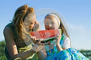 Happy child eating watermelon