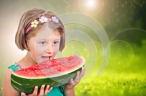 Happy child eating watermelon in the garden