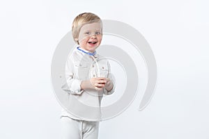 Happy child family doctor with stethoscope on white background with copy space
