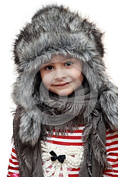 Happy child with furry winter hat photo