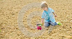 Happy child gardener. spring country side village. ecology and environmental protection. earth day. soils fertilizers