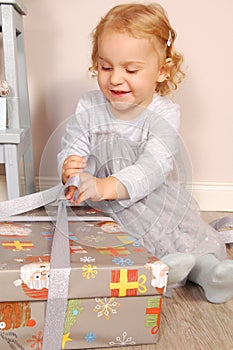 Happy child with gift box.