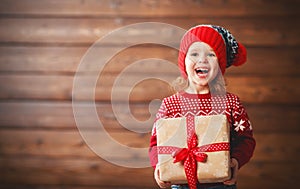 Happy child girl with Christmas present