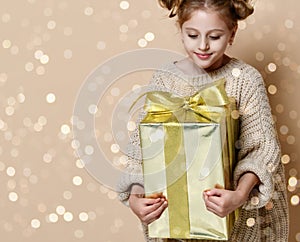 Happy child girl with gift box