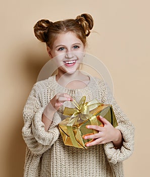 Happy child girl with gift box