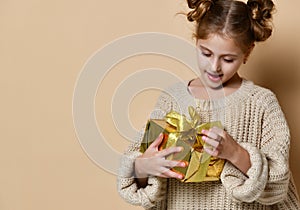 Happy child girl with gift box