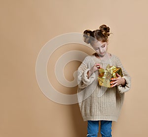 Happy child girl with gift box