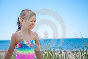 Happy child girl portrait on the beach