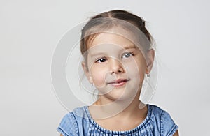 Happy child girl portrait on a white background with copy space