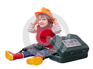 Happy child in hardhat with tools