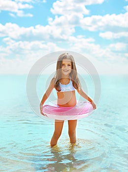 Happy child having fun bathing