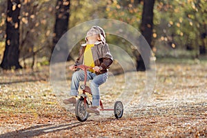 Happy child having fun outdoor in autumn park