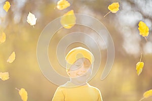 Happy child having fun outdoor in autumn park