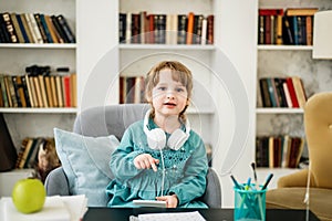 Happy child, healthy food, baby girl eating fruit at school