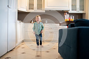 Happy child and his sibling playing a game indoors