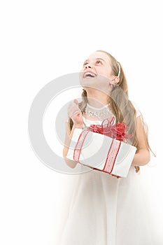 Happy child hold box with red bow