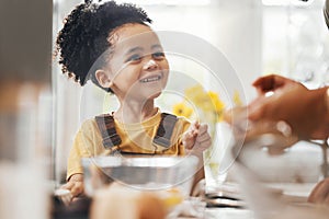 Happy child in kitchen, baking and learning with parent and cake flour on face, little baker making breakfast or cookies