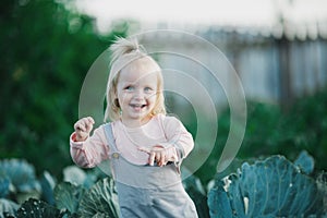 Happy Child Laugh In Cabbage Garden Summertime