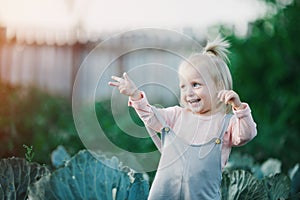 Happy Child Laugh In Cabbage Garden Summertime