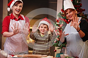 Happy child with mom and grandmother at christmas