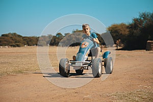 Happy Child on an open Go-Kart enjoying the outdoor sport activity. This was taken in South Africa.