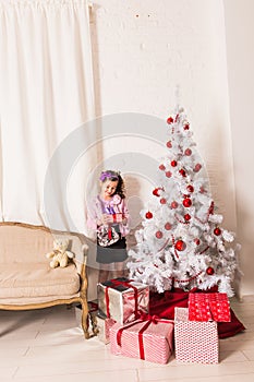 Happy child opening Christmas gift box