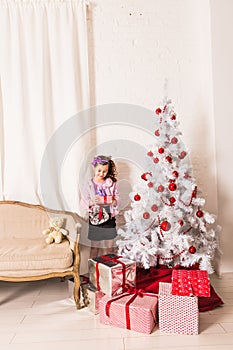 Happy child opening Christmas gift box