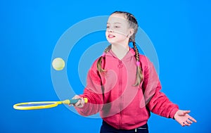 Happy child play tennis in gym staduim. Sport game success. Tennis player with racket and ball. Childhood activity