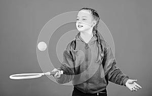 Happy child play tennis in gym staduim. Sport game success. Tennis player with racket and ball. Childhood activity