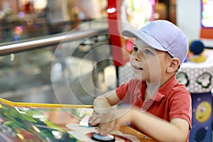 Happy child playing in amusement park