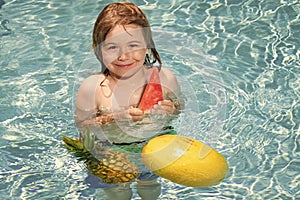 Happy child playing in swimming pool. Summer pineapple amd watermelon fruit for children.