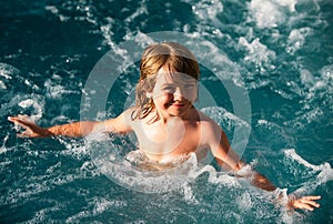 Happy child playing in swimming pool. Summer vacation concept. Hot tub. Summer kids holidays.