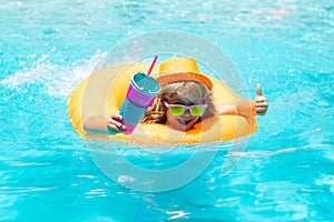 Happy child playing in swimming pool. Summer vacation concept. Summer kids portrait in sea water on beach.