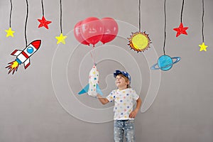 Happy child playing toy rocket