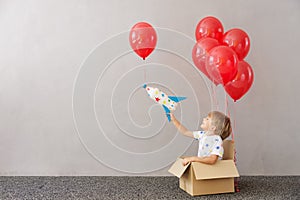 Happy child playing toy rocket