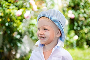 Happy child portrait. Adorable baby having fun. Beautiful fun day for cute little boy in nature. Happy little boy.