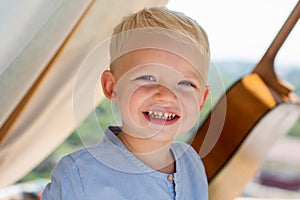 Happy child portrait. Child play outdoors. Happy childhood. Funny little boy. Boy on camping.