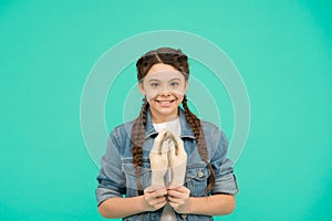 Happy child prayer pray holding artificial dummy hands blue background, praying