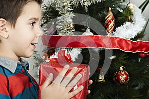 Happy child receive the gift of Christmas