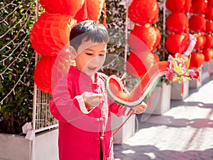 A happy child in red traditional costume