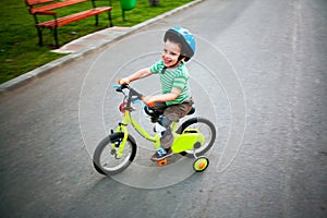 Happy child riding bike