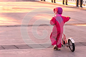 Happy child riding a bike.