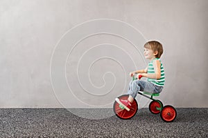 Happy child riding vintage trike