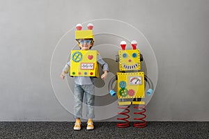 Happy child with robot have an idea